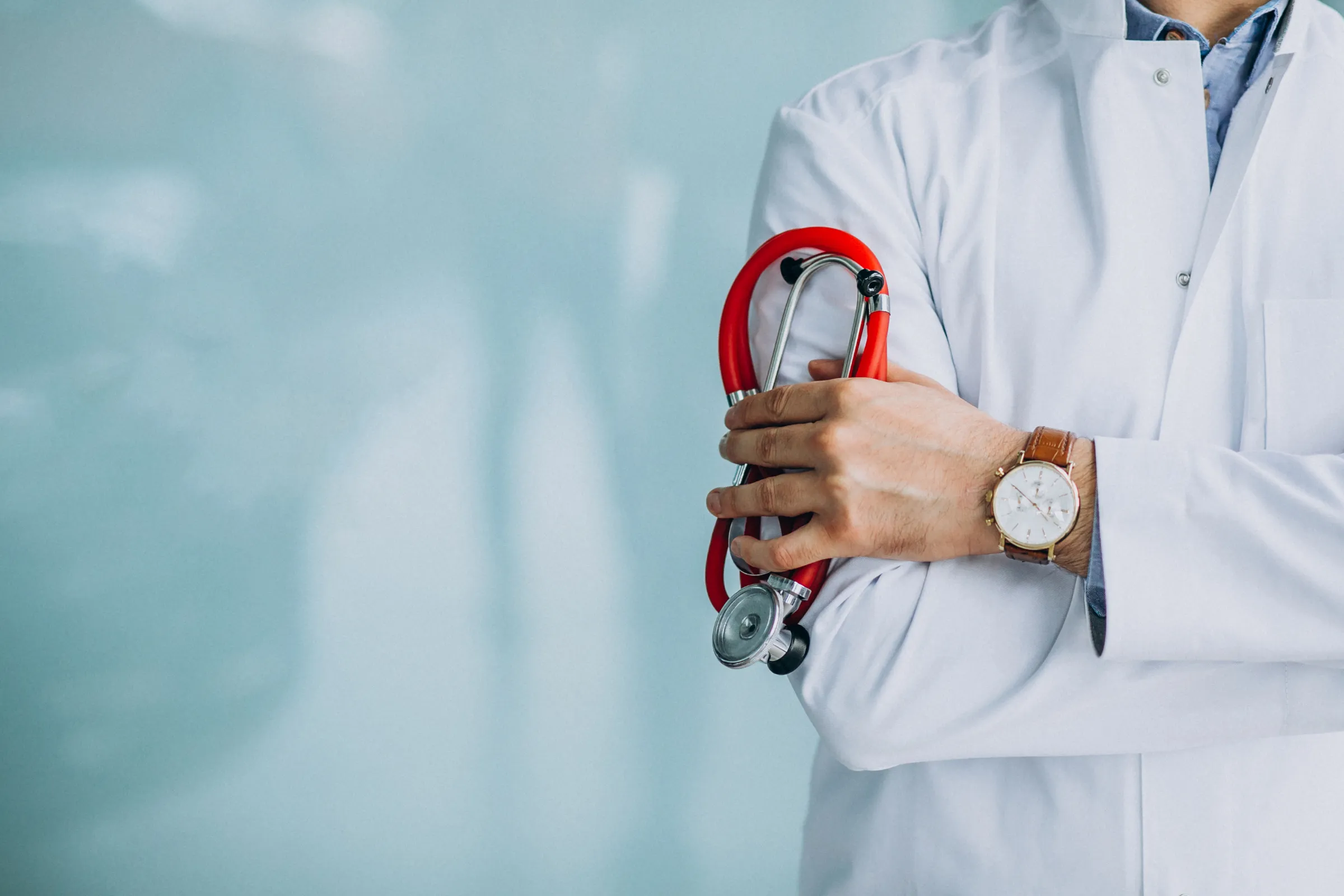 Young handsome physician medical robe with stethoscope